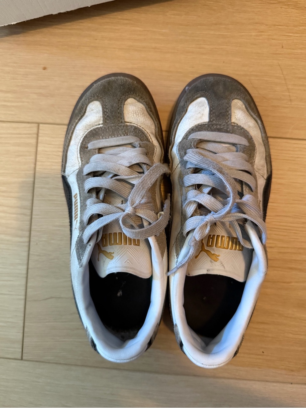 Extremely worn. Puma Gray and White Suede Low-Top Sneakers with Gold Logo